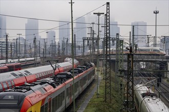 Railway tracks with regional and long-distance trains, ICE, after freezing rain, in front of