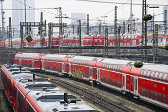 Railway tracks with regional trains, after freezing rain, in front of Frankfurt main station,