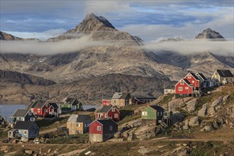 Inuit settlement at a fjord with icebergs, mountainous, autumn, sunny, Tasiilaq, East Greenland,