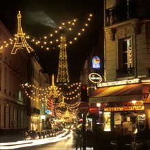 Christmas lights with the Eiffel Tower in the background, Paris, France, Europe