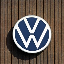 Large VW logo on the old cogeneration plant, Volkswagenwerk Wolfsburg, main plant of Volkswagen AG,