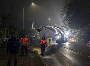 Transport of a 68 metre long, 22 tonne blade of a wind turbine, here in Breckerfeld, with a