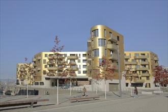 Modern golden building Pandion Doxx, golden, residential complex, pedestrian, customs harbour,