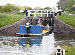 Maintenance boat at Caen Hill flight of locks on the Kennet and Avon canal Devizes, Wiltshire,