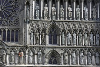 Gothic cathedral with stone statues and religious figures on the façade, Nidaros Cathedral, old