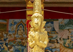 Gilded deity statue, Wat Phonxay, Luang Prabang, Laos, Asia