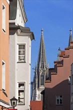 Tower of Regensburg's St Peter's Cathedral, completed around 1860, old town houses to the right and