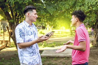 Young man chatting with young man, two people arguing WITH COPY SPACE