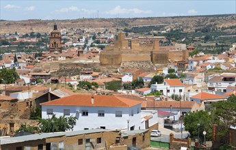 Panoramic view of a historic city with an old fortress, red roofs and arid surroundings, Cathedral,