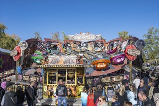 Crowd of people on fairground, amusement park, amusement ride, fairground rides, at the traditional