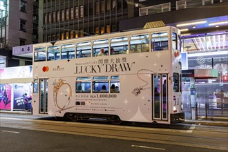 Hong Kong Tramway double-decker public transport at the Pedder Street stop in Hong Kong, China,