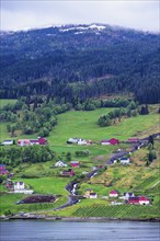 Mountains and Fiord over Norwegian Village in Olden, Innvikfjorden, Norway, Europe