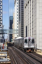 Chicago L Elevated elevated metro train public transport train at the Harold Washington Library