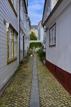 Historic town centre of Bergen with narrow streets and cobblestones surrounded by traditional