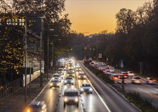 City centre street with heavy traffic in the evening. Dynamic light trails with long exposure time.