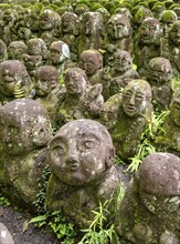 Moss-covered stone statues of rakans, the disciples of Buddha, Otagi Nenbutsu-ji temple, Kyoto,