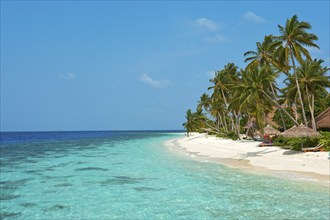 View of beach with turquoise blue water in shallow lagoon of Maldives island Filaidhoo in Indian