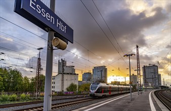 Regional train arriving at Essen central station, platform, city centre skyline, North