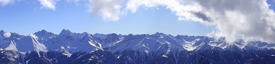 Alpine panorama with snow-covered mountain peaks in winter. Taken in the ski resort of Serfaus Fiss