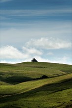 Isolated farm called buron on the Cezallier plateau in the Auvergne Volcanoes Regional Natural