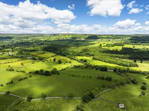 Farms and Fields over Bainbridge Village from a drone, Leyburn, North Yorkshire, England, United