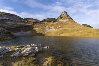 Lake Augstsee and the Atterkogel mountain on the Loser. Autumn, good weather, blue sky. Altaussee,