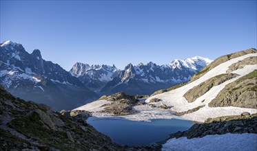 Mountain landscape in the morning light with mountain lake Lac Blanc, mountain peaks Grandes