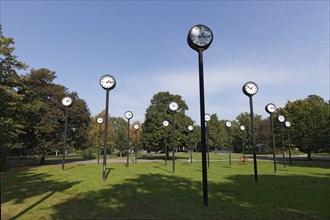 Station clocks with synchronised time, art installation Zeitfeld by Klaus Rinke in the Volksgarten