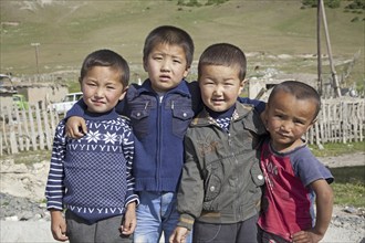 Four young Kyrgyz boys showing Chinese features, Osh Province, Kyrgyzstan, Asia