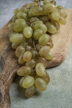 A branch of white grapes, wine grapes, Georgian grape variety Rkatsiteli, top view