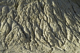 Gullies in soft rock of cliff caused by rain water erosion