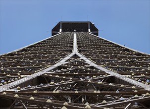 Close-up of the impressive steel structure of the Eiffel Tower from below, Paris