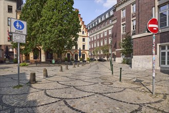 Pedestrian zone Liefergasse with historic brick buildings in the historic city centre Düsseldorf,