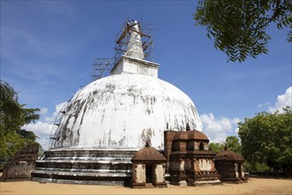 Sri Lankan workers at the Kiri Vehera stupa in the ruined city of Polonnaruwa, Central Province,