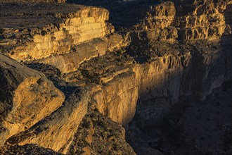 View from the Al Hayl mountain plateau of the rock face of the Grand Canyon of Oman, Arabian