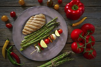 Grilled chicken breast with brochette vegetable with grill asparagus