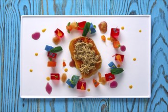 Foie slice with grated white truffle and colorful jelly decoration