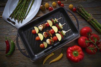 Brochette vegetable on grill pan with tomato onion pepper zucchini