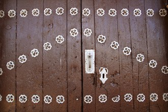 Anciend wood door with metal silver decoration rustic