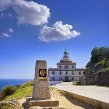 End of Saint James Way sign and lighthouse of Finisterre in Galicia Spain photomount