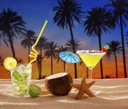 Beach cocktail sunset on palm tree sand mojito margarita coconut