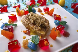 Foie slice with grated white truffle and colorful jelly decoration