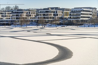 The snow-covered and frozen Phoenix Lake in Dortmund, North Rhine-Westphalia, Germany, Europe