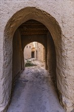 Narrow passageway in the largest preserved mud town in Oman, Al Bilaad, Al Bilaad Historical