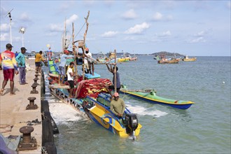 Sri Lankan fishermen on colourful outrigger boat on the Indian Ocean, Kapparatota, Matara, Southern