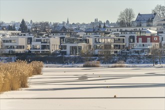 The snow-covered and frozen Phoenix Lake in Dortmund, North Rhine-Westphalia, Germany, Europe