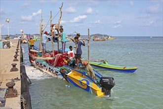 Sri Lankan fishermen on colourful outrigger boat on the Indian Ocean, Kapparatota, Matara, Southern