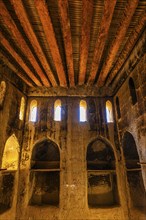 Large hall with wooden ceiling in the largest preserved mud town in Oman, Al Bilaad Historical