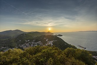 Sunset over a coastal landscape with views of the ocean and hilly islands, Lastovo, Neretva,