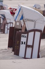 Close-up of beach chairs on the sandy beach with subtle colouring, Borkum, North Sea, GERMANY